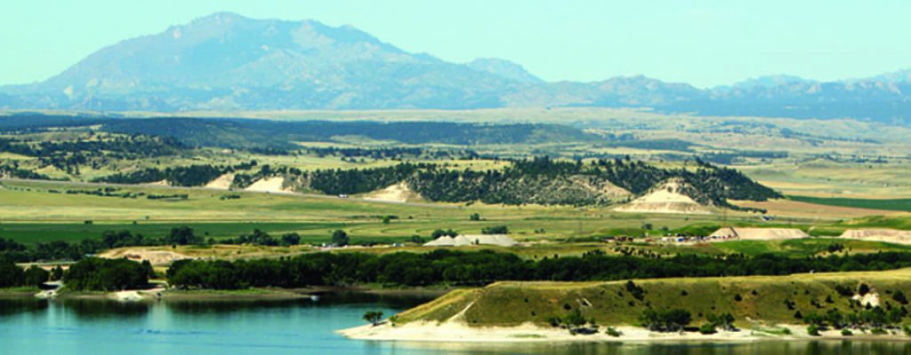 Mountain peak in the distance beyond a lake