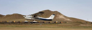 Small airplane taking off from Glendo Wy.